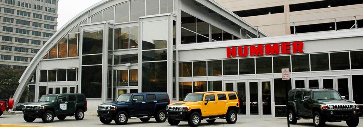 Exterior of car dealership showcasing glass and steel structure built by KasCon commercial general contractors