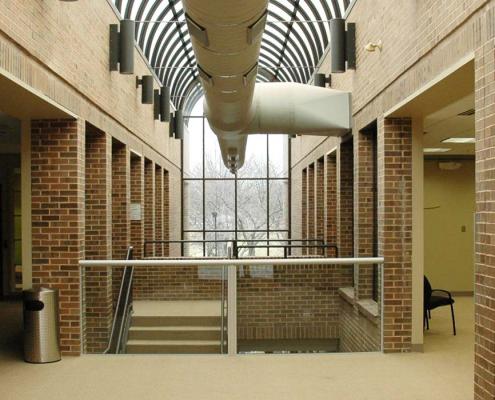 Hallway with curved skylight and large window for sanctuary renovation project