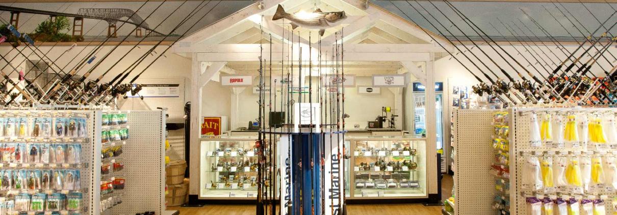 Interior retail construction showing fishing rod and lures display